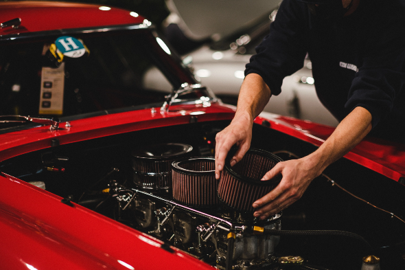 man_fixing_car